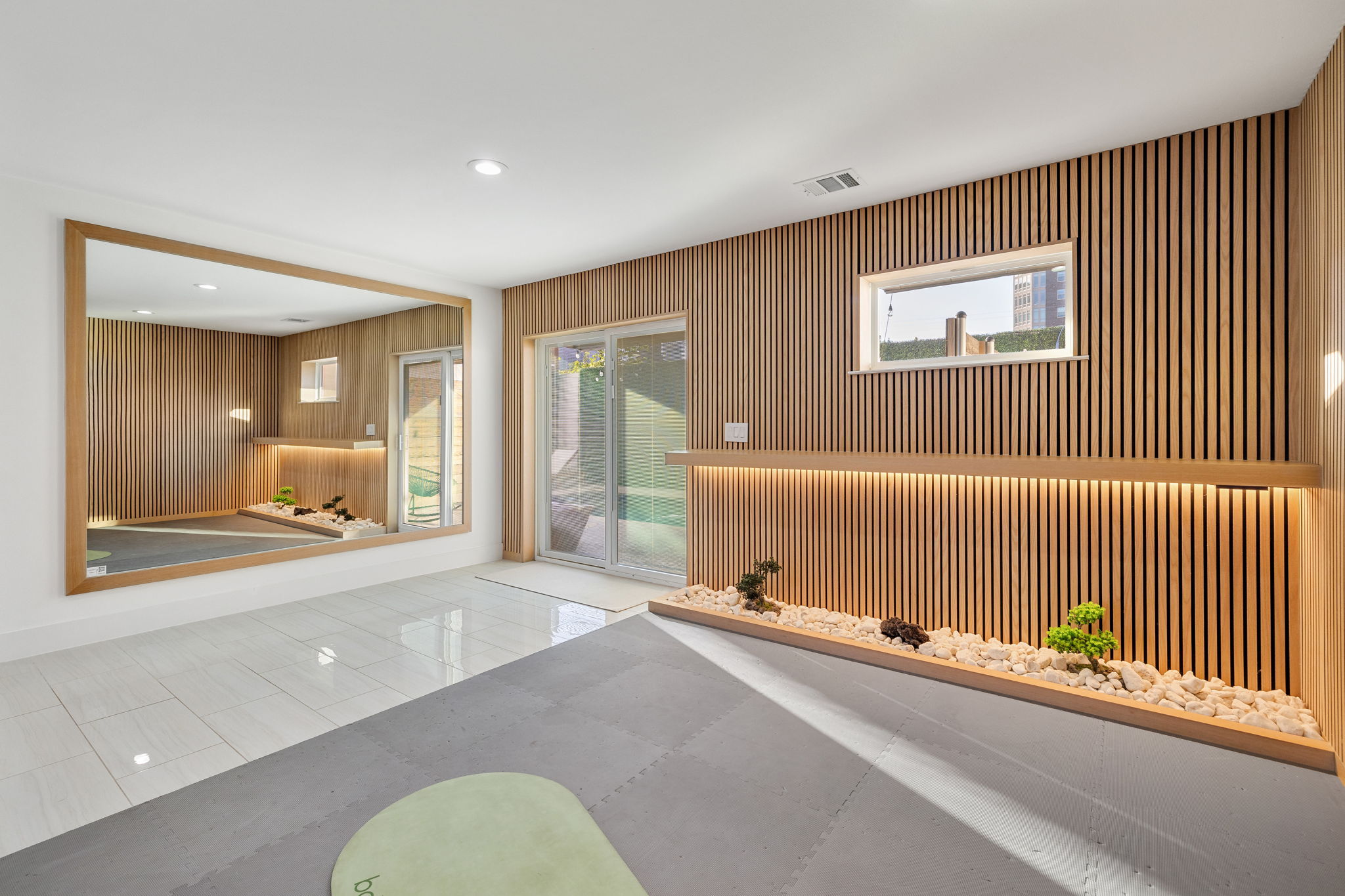 Private fenced patio with outdoor couches