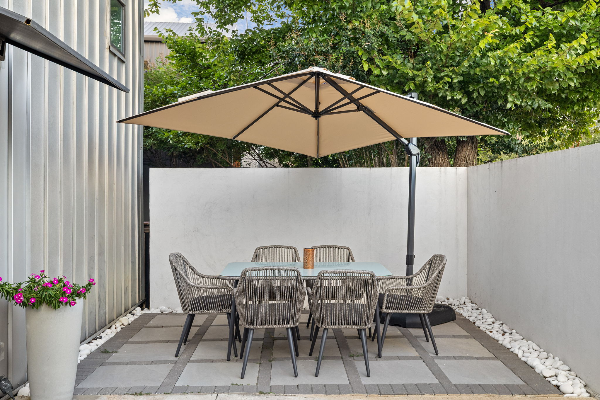 Outdoor dining table under covered patio